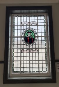 Library saint in a stained glass window